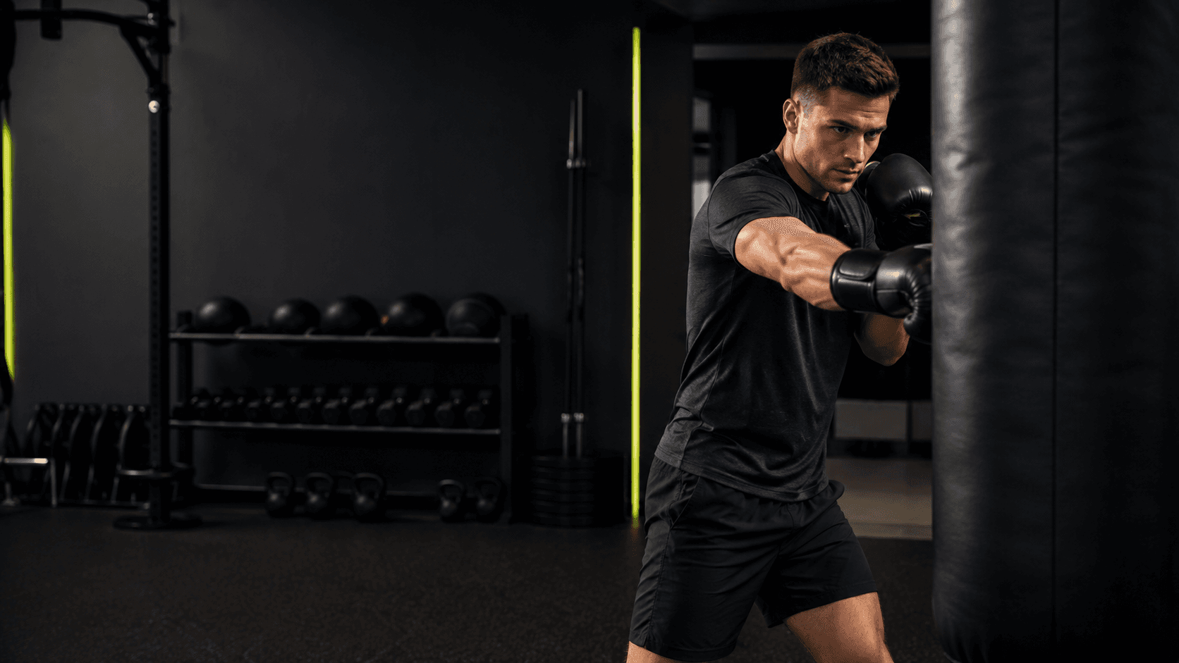 Boxer training with focus on a heavy bag at Pulse House Fitness