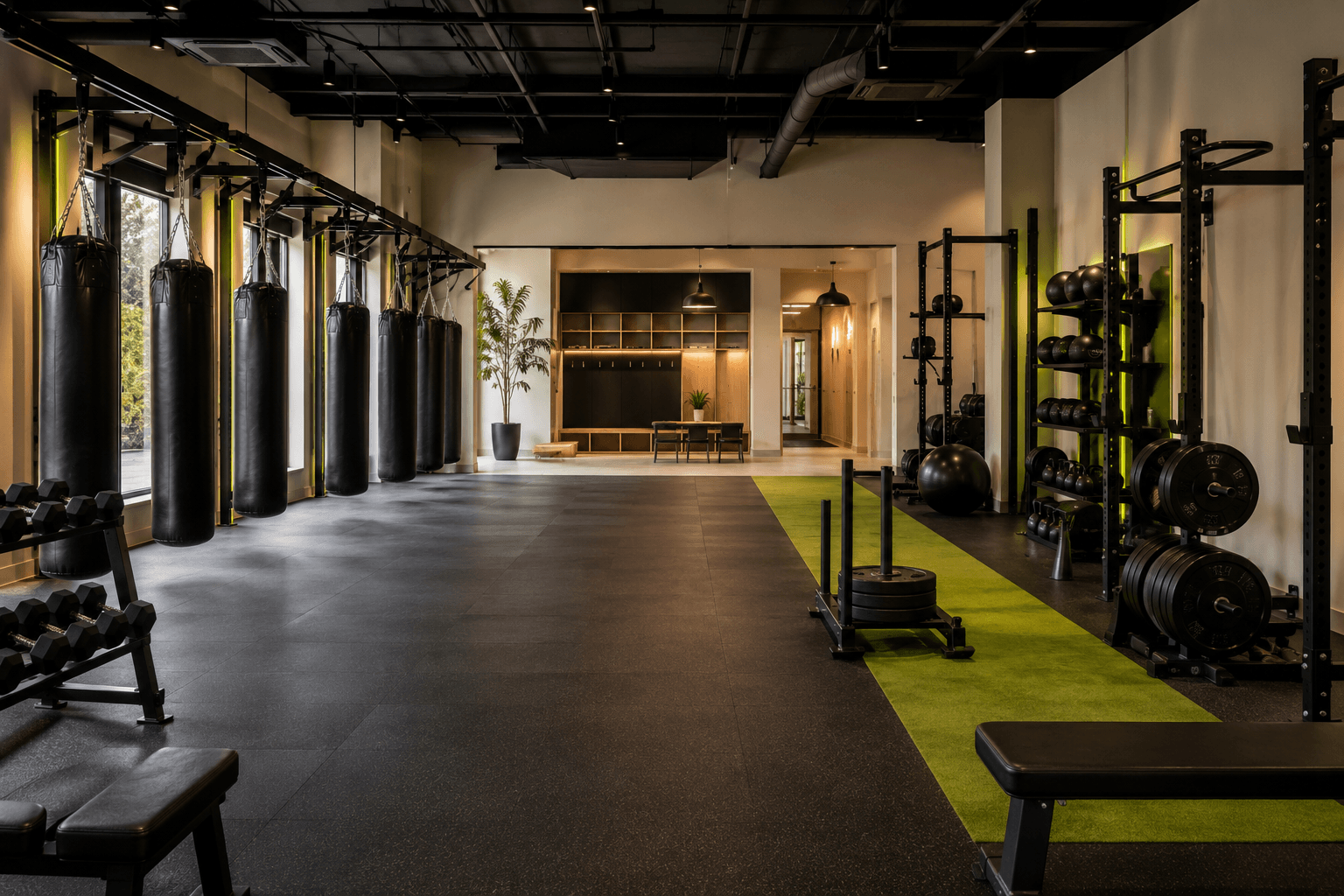 Pulse House studio with boxing bags, strength equipment, and open training space